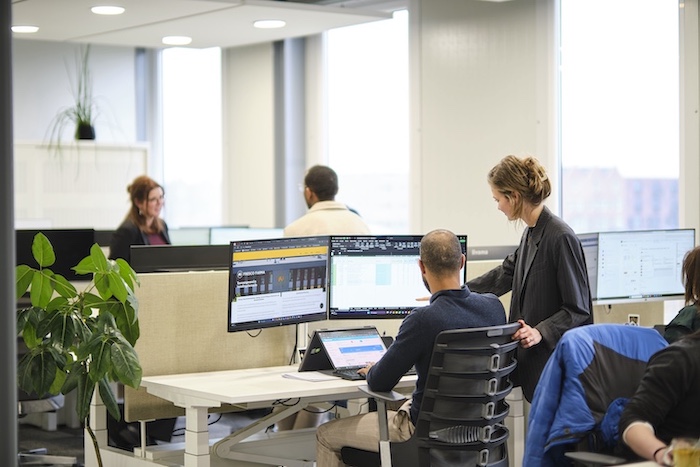 Collegeaus in conversation at the Fresco Farma office